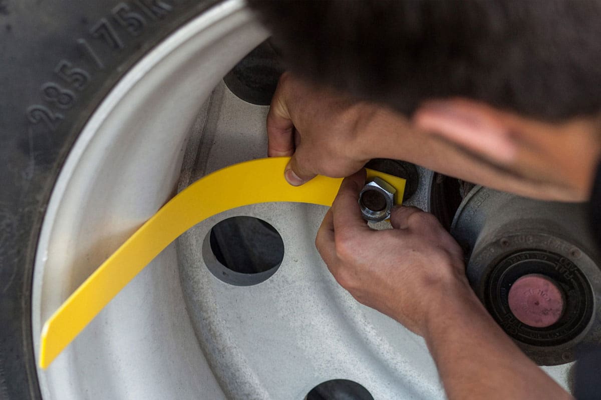 A person installing a tire