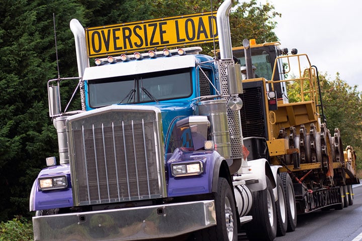 A big Truck with a "Oversize Load" sign